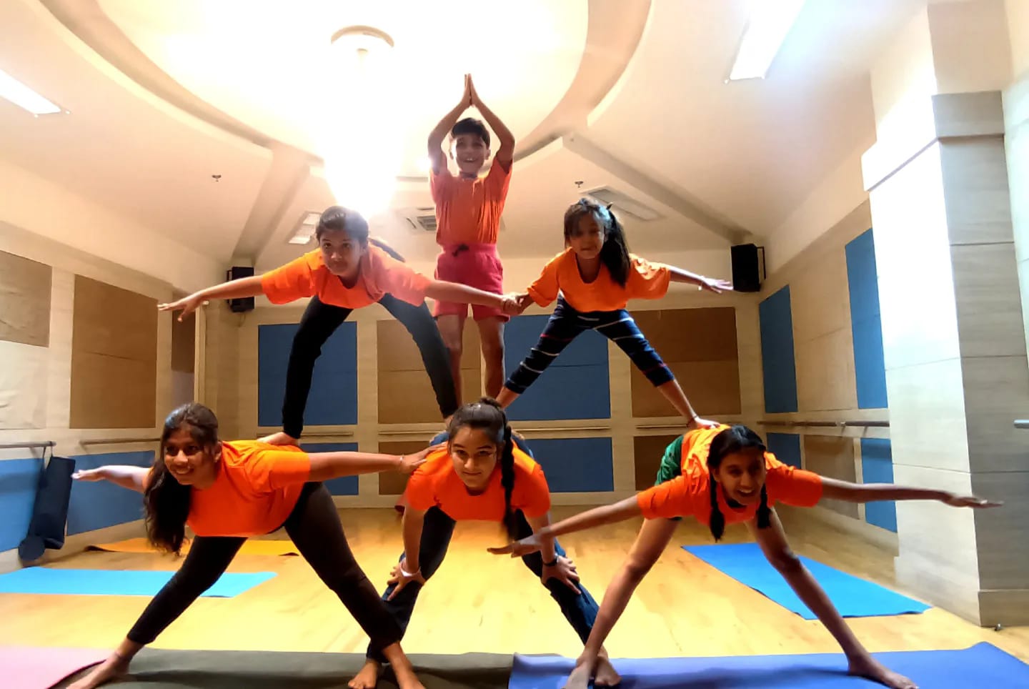Warrior pose in sunlit studio
